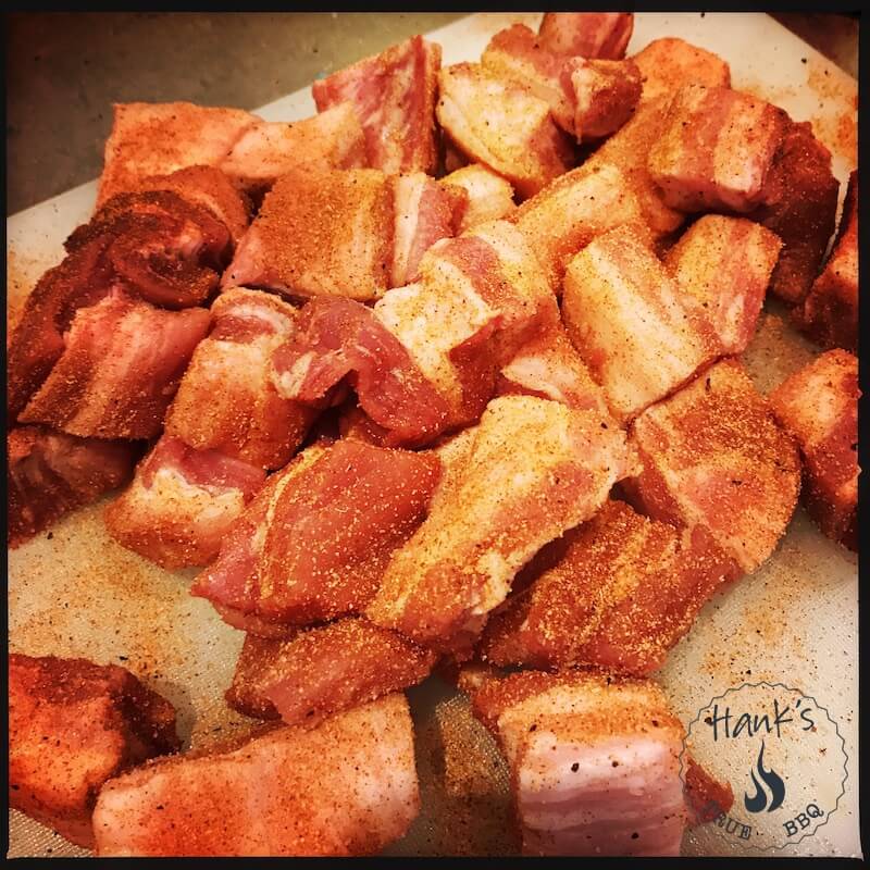 Diced pork belly with rub applied