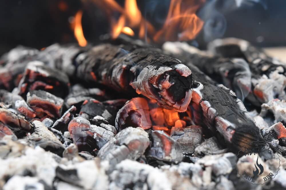 Glowing embers in a Parrilla