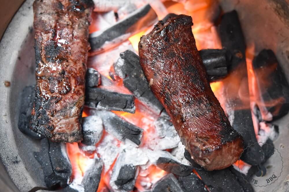 Caveman grilling - meat on the coal bed